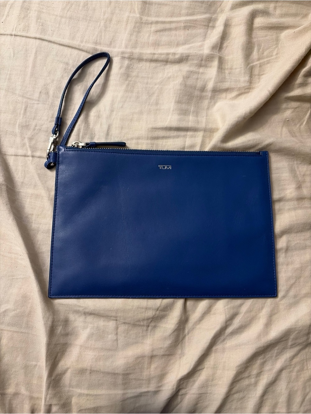 TUMI Royal Blue leather wristlet/ travel pouch